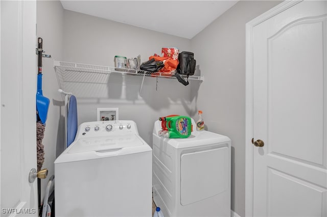 washroom with washer and clothes dryer