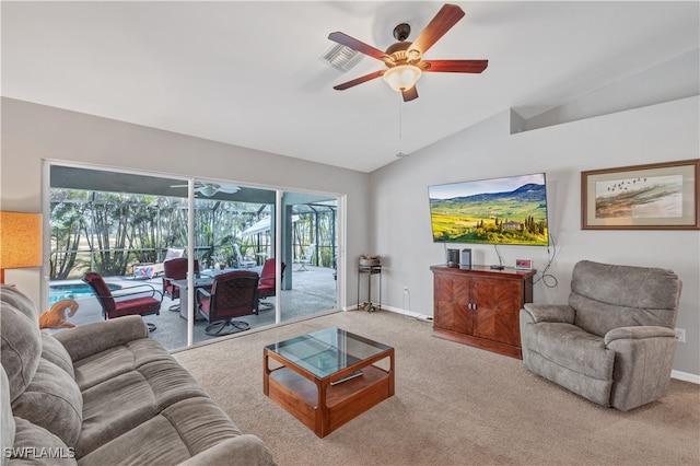 carpeted living room featuring ceiling fan and vaulted ceiling