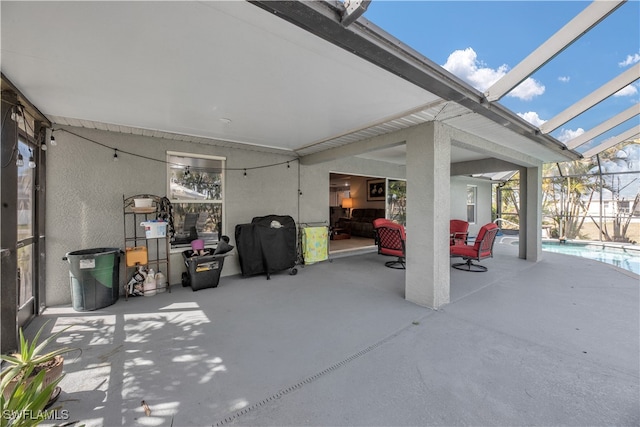 view of patio with a lanai