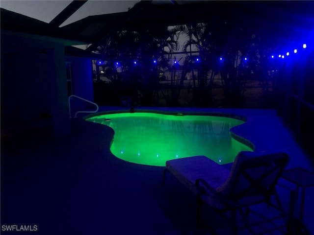 view of pool at night