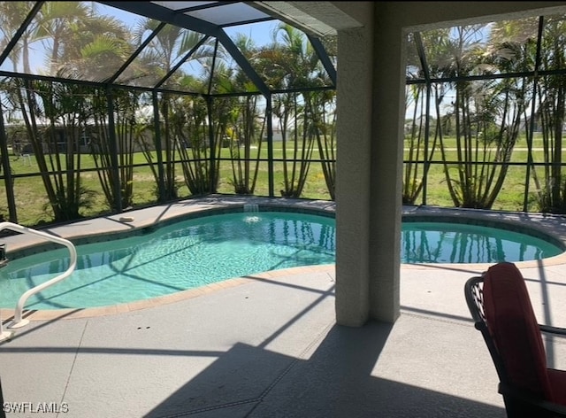 view of pool featuring a lanai, a yard, and a patio