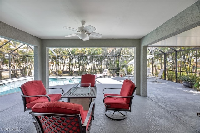 sunroom / solarium with ceiling fan