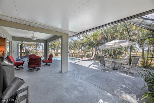 view of patio / terrace featuring a fenced in pool, ceiling fan, and a lanai