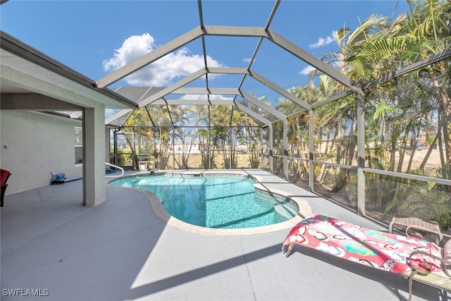 view of pool featuring a patio and a lanai