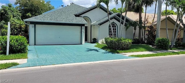 single story home featuring a garage