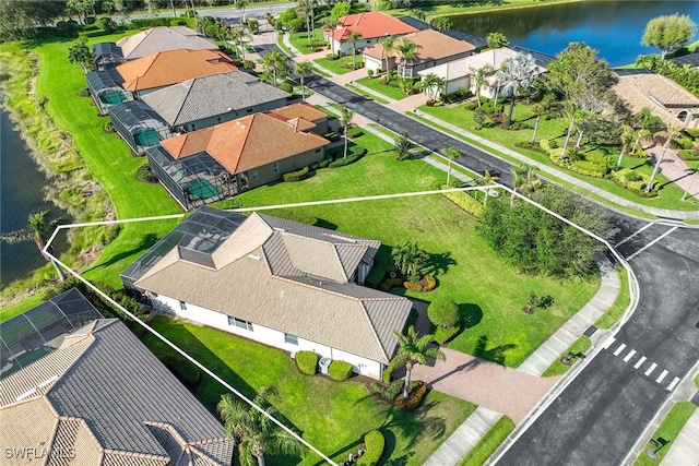 drone / aerial view with a water view