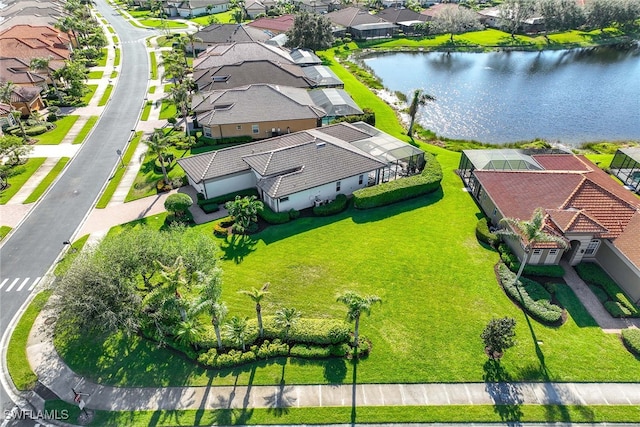 birds eye view of property featuring a water view