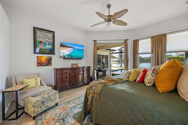 bedroom with ceiling fan, light hardwood / wood-style floors, and access to outside