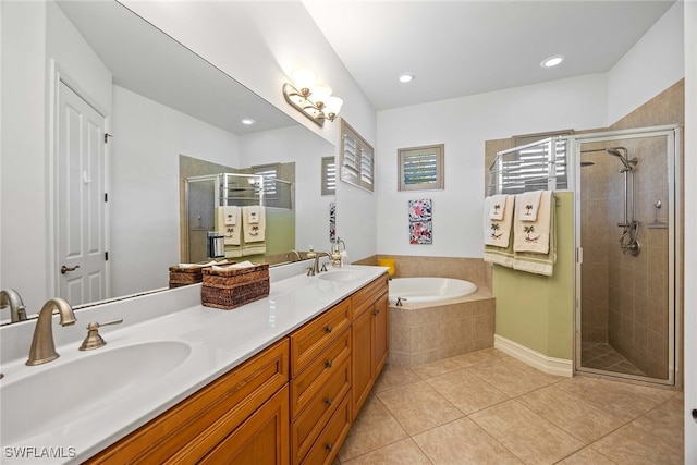 bathroom with tile patterned flooring, vanity, and independent shower and bath