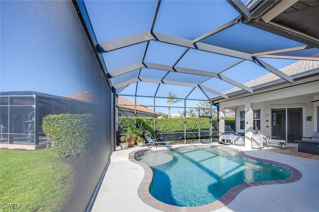 view of swimming pool with a patio and a lanai