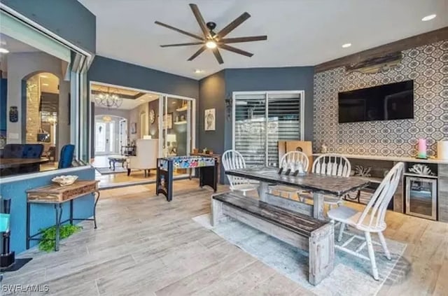 dining space with light wood-type flooring and ceiling fan