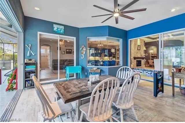 dining area featuring hardwood / wood-style floors and ceiling fan