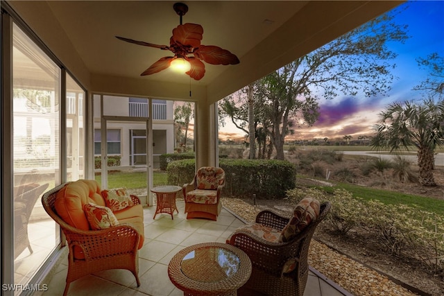 sunroom / solarium featuring ceiling fan