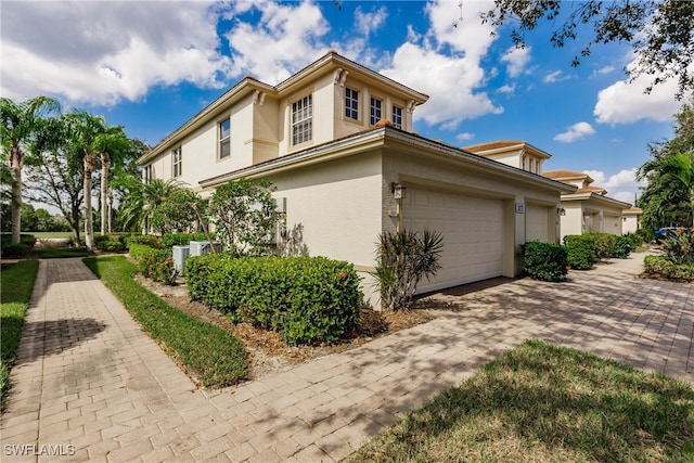 view of property exterior featuring a garage