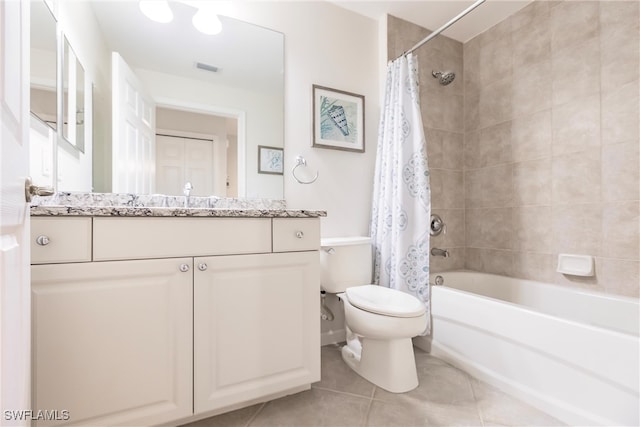 full bathroom featuring tile patterned floors, toilet, vanity, and shower / tub combo