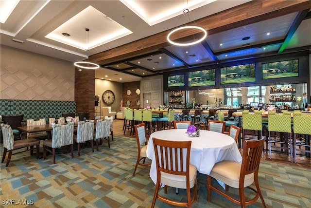 dining space with carpet and bar