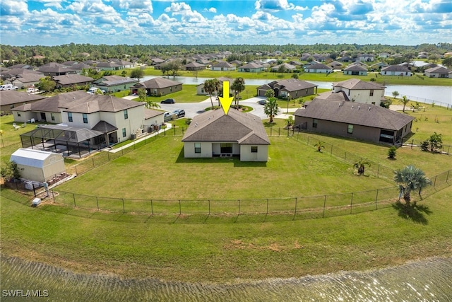 birds eye view of property featuring a water view