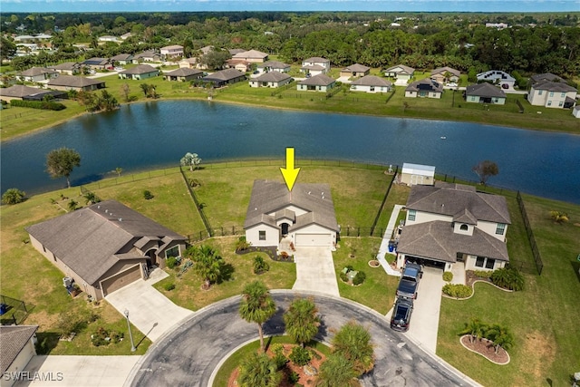 birds eye view of property with a water view