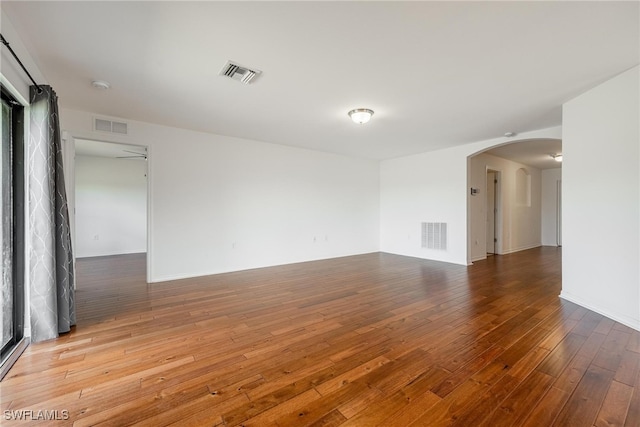 unfurnished room featuring hardwood / wood-style floors