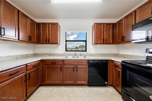 kitchen with light tile patterned flooring, black appliances, and sink