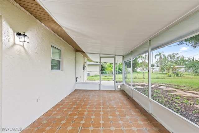 unfurnished sunroom with a wealth of natural light