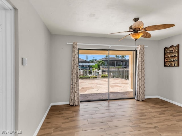 spare room featuring ceiling fan and light hardwood / wood-style flooring