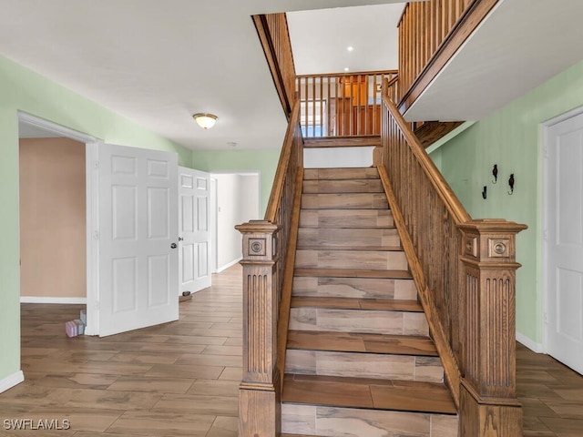 stairway featuring hardwood / wood-style floors