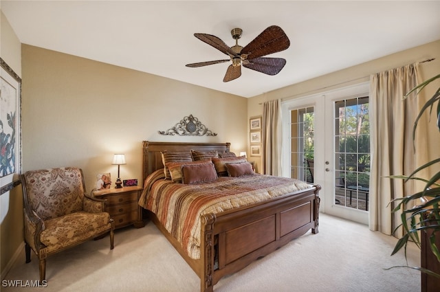 carpeted bedroom with french doors, access to exterior, and ceiling fan