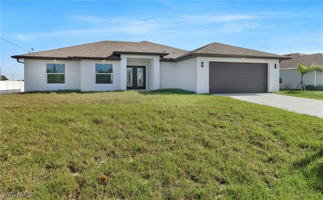 view of front of house featuring a garage and a front yard