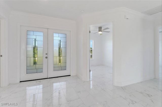 entryway with ornamental molding, french doors, and ceiling fan