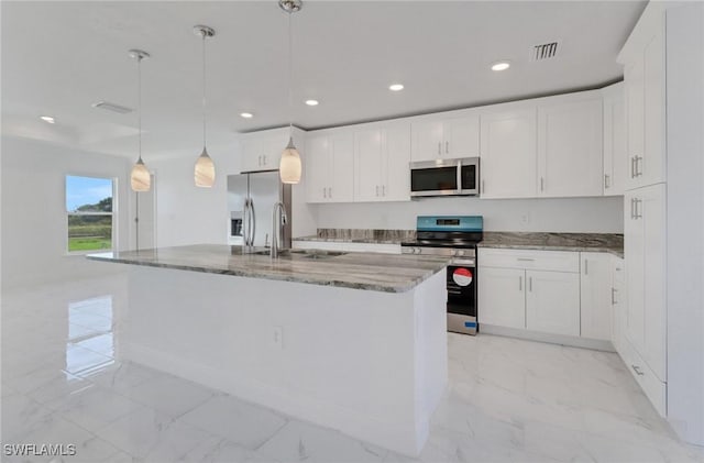 381 Paulcrest Ave, Lehigh Acres, FL 33974 - kitchen featuring stainless steel appliances, light marble finish floors, recessed lighting, light stone countertops, and white cabinets