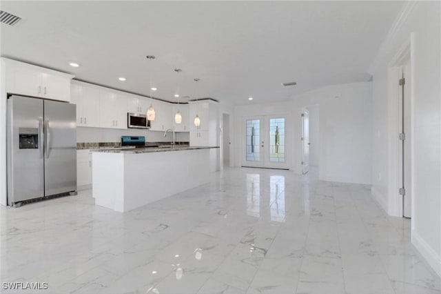 381 Paulcrest Ave, Lehigh Acres, FL 33974 - kitchen featuring appliances with stainless steel finishes, light marble finish flooring, open floor plan, a sink, and white cabinetry