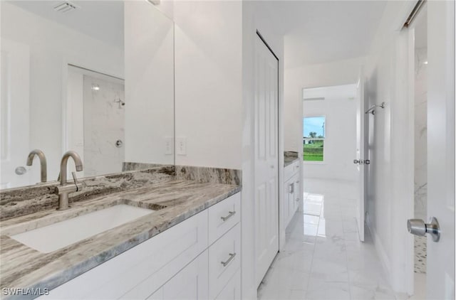 381 Paulcrest Ave, Lehigh Acres, FL 33974 - bathroom featuring marble finish floors and vanity