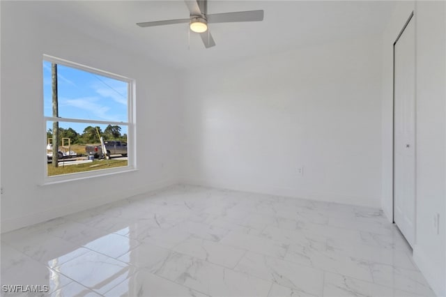 unfurnished room with ceiling fan