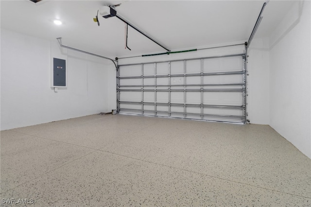 garage featuring electric panel and a garage door opener