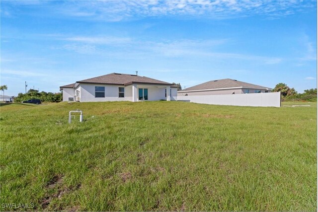 381 Paulcrest Ave, Lehigh Acres, FL 33974 - rear view of property featuring stucco siding