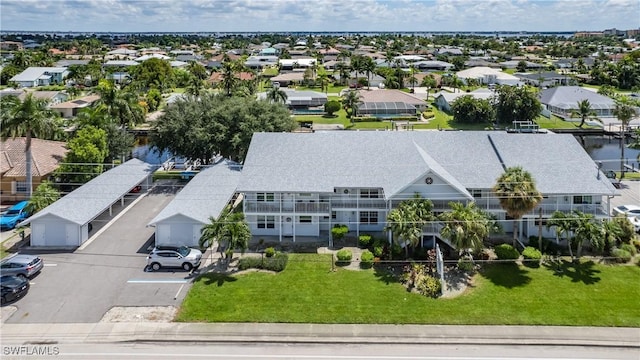 birds eye view of property with a residential view