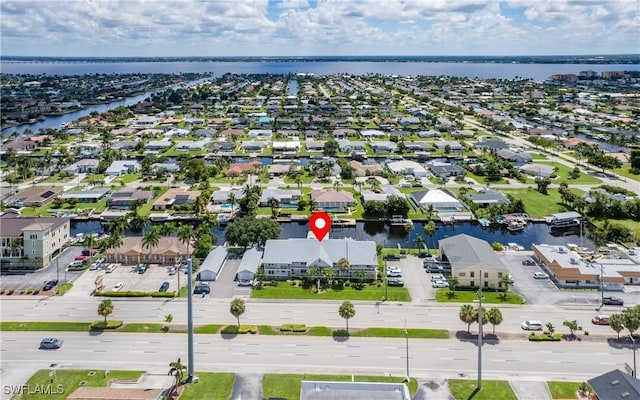 aerial view with a water view and a residential view