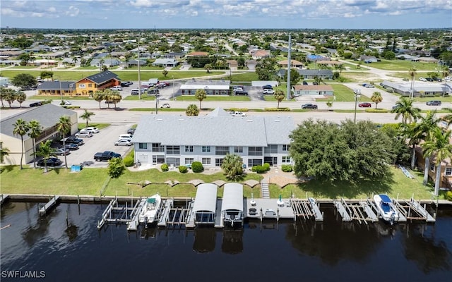 birds eye view of property with a residential view and a water view