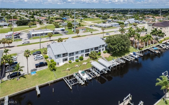 bird's eye view featuring a residential view and a water view