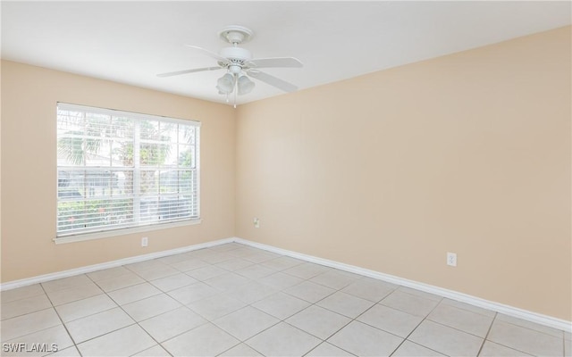 unfurnished room with baseboards and a ceiling fan