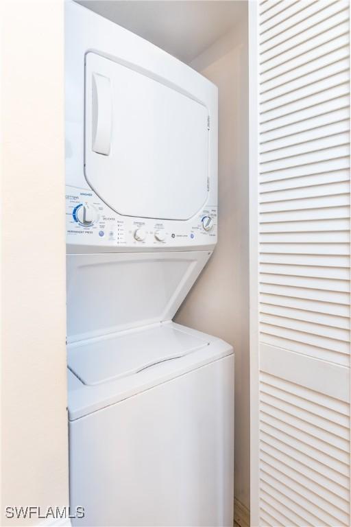 laundry room with laundry area and stacked washer / drying machine