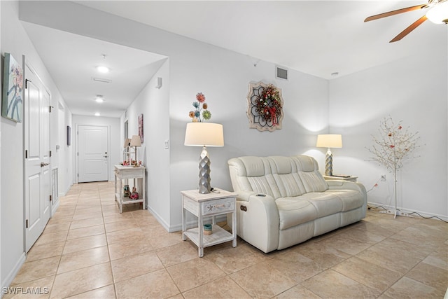 living room with ceiling fan and light tile patterned floors