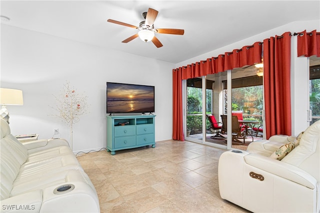 tiled living room featuring ceiling fan