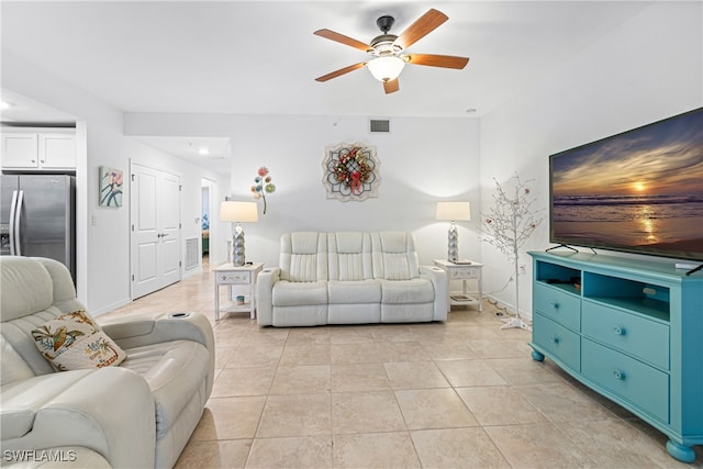 living room with ceiling fan and light tile patterned floors