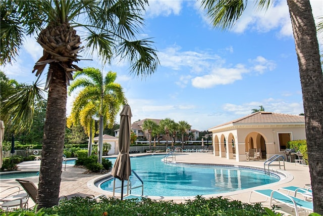 view of swimming pool with a patio