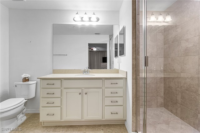 bathroom with vanity, toilet, tile patterned flooring, and a shower with door