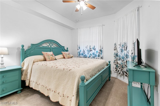 carpeted bedroom with ceiling fan