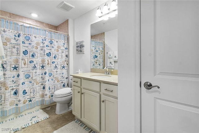 bathroom with vanity, toilet, tile patterned floors, and a shower with shower curtain