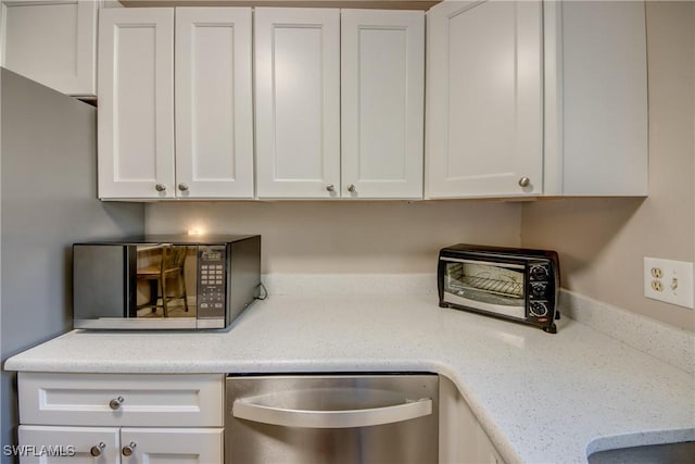 details with white cabinetry, dishwasher, and light stone counters